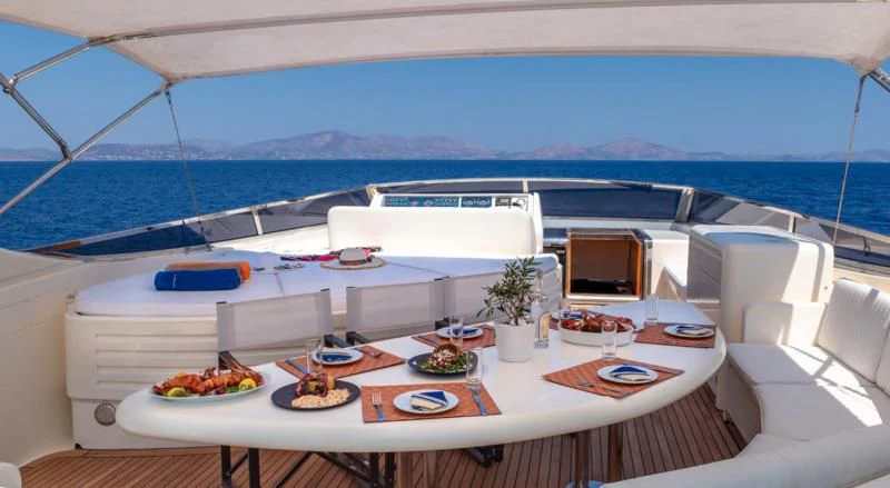 a large white boat on a large body of water aboard EFMARIA Yacht for Sale