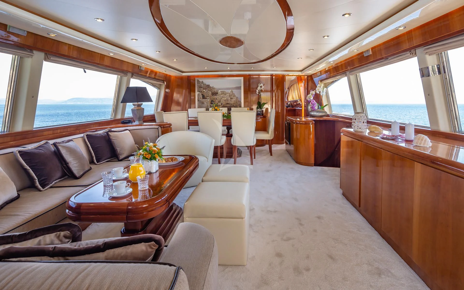 a living room with a large window aboard EFMARIA Yacht for Sale