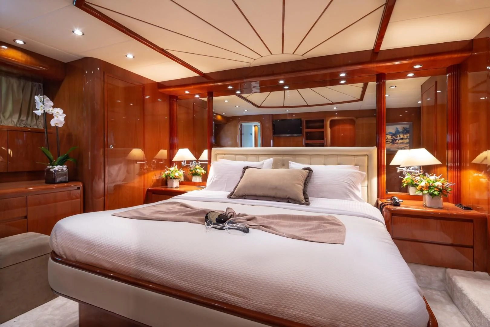 a bed with white sheets aboard EFMARIA Yacht for Sale