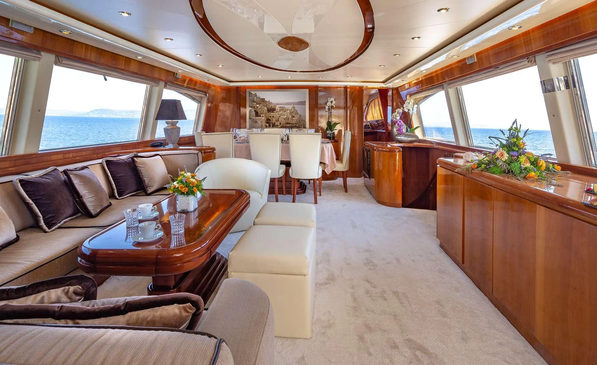 a living room with a couch and a table aboard EFMARIA Yacht for Sale