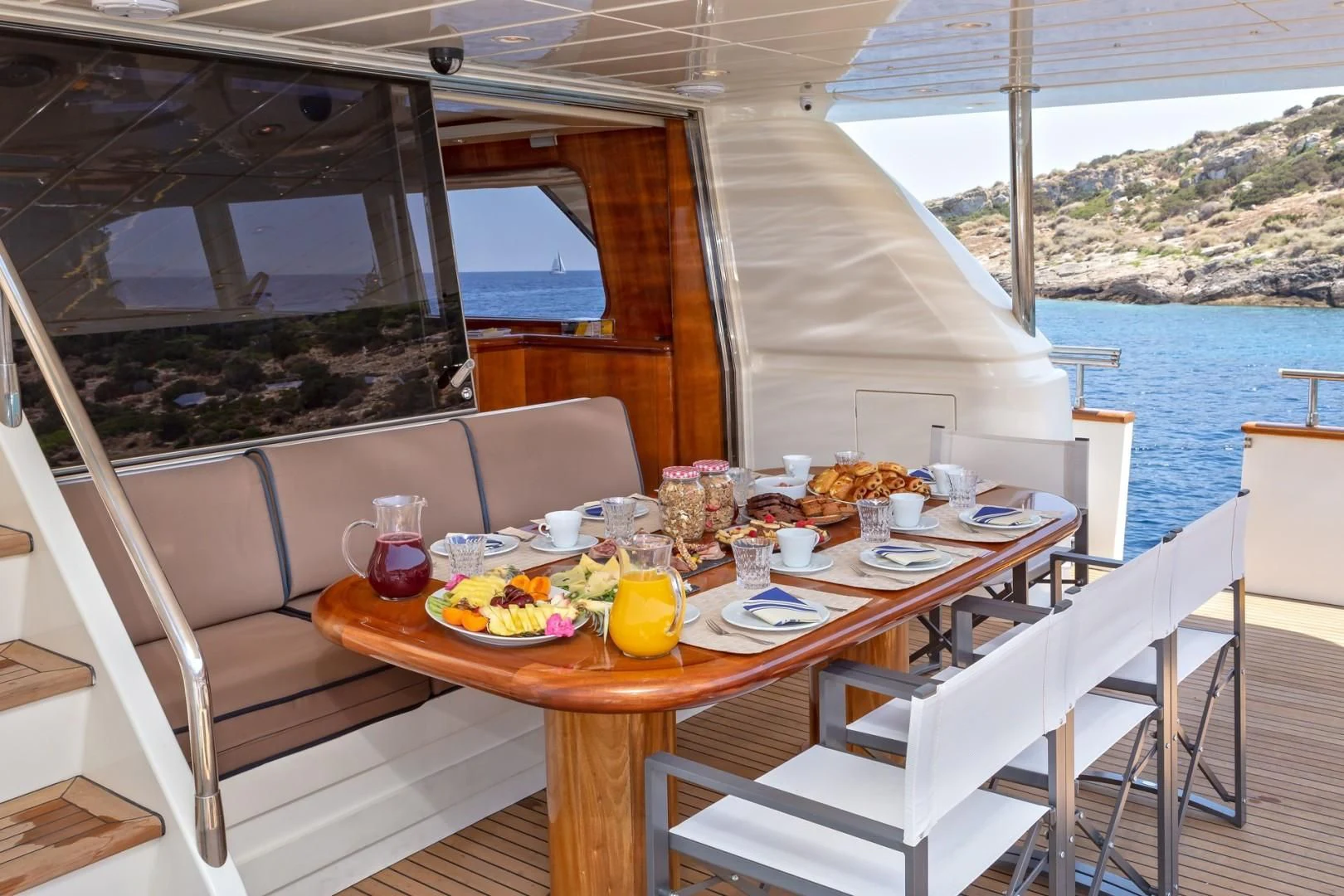 a table with food on it aboard EFMARIA Yacht for Sale