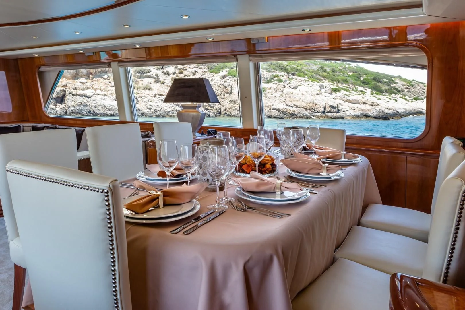 a table set for a dinner aboard EFMARIA Yacht for Sale