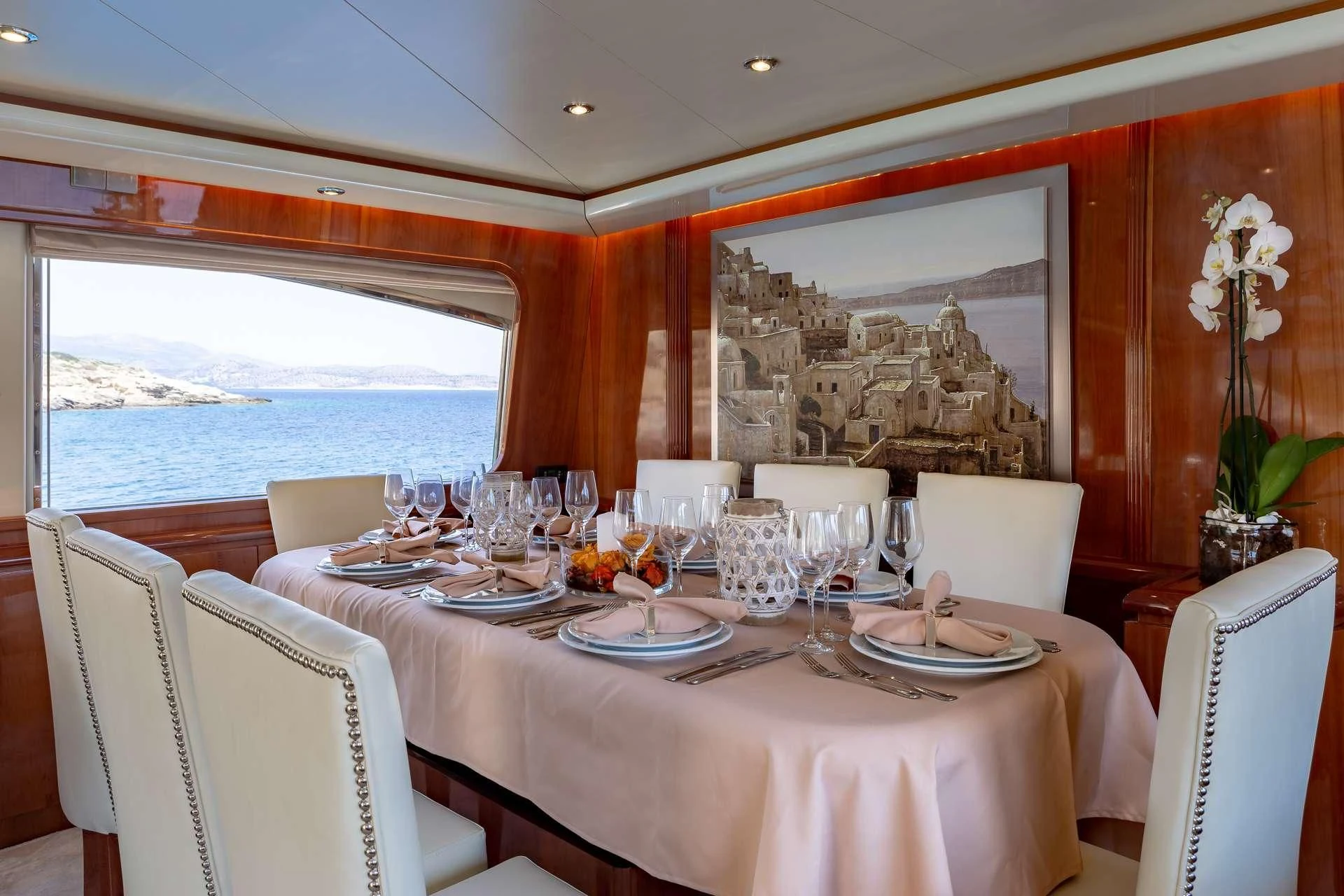 a dining table set for a dinner aboard EFMARIA Yacht for Sale