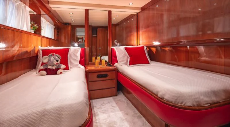a room with two beds aboard EFMARIA Yacht for Sale