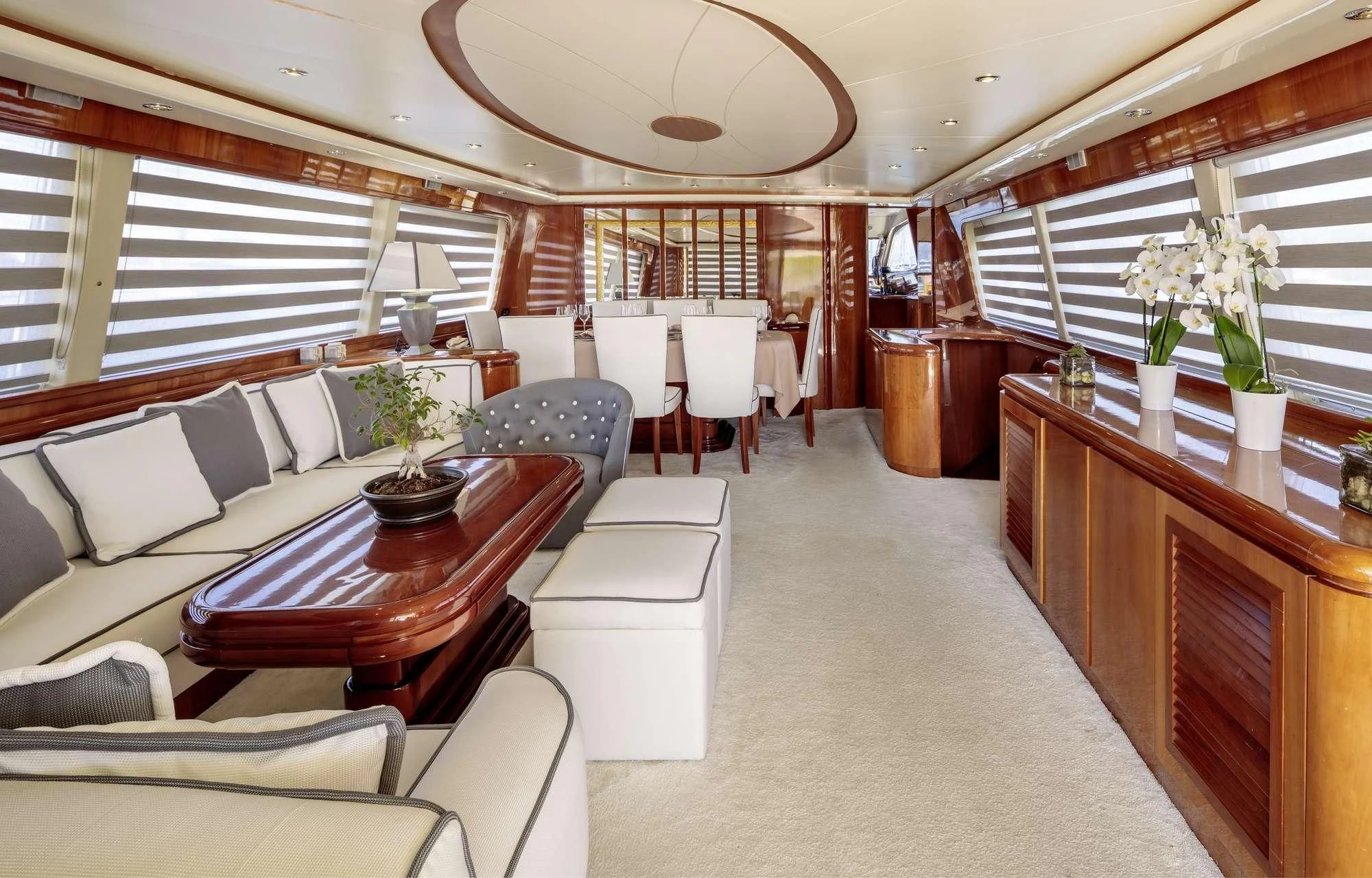 a room with a table and chairs aboard EFMARIA Yacht for Sale