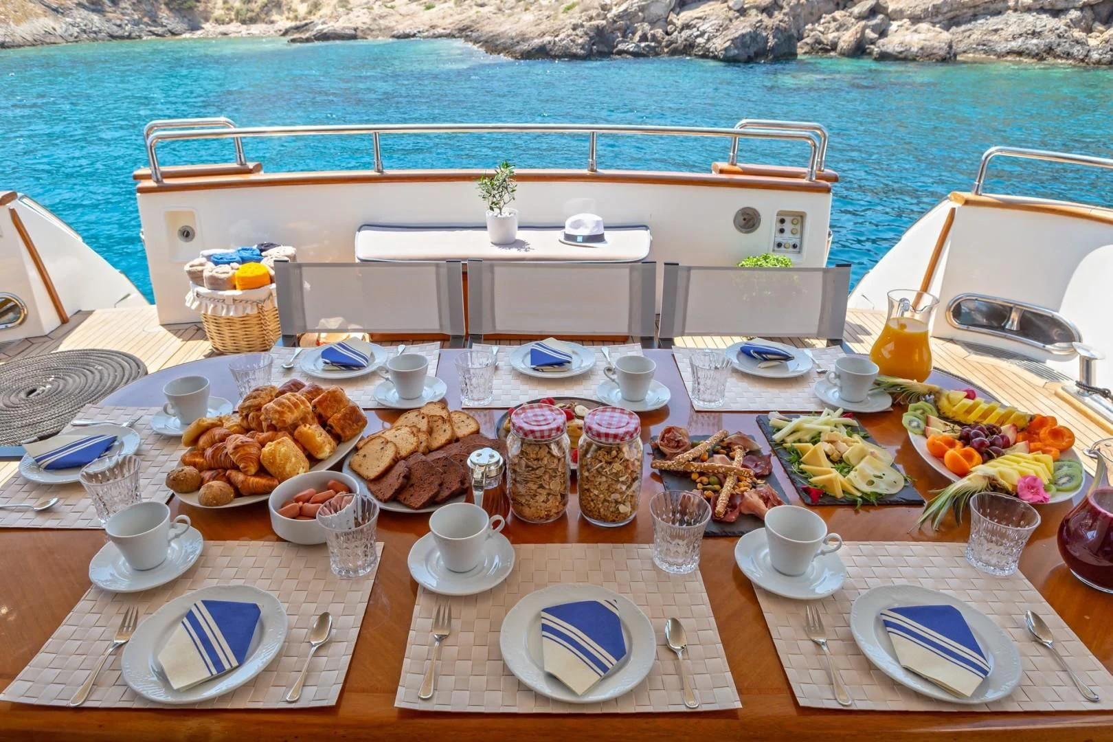 a table with food on it aboard EFMARIA Yacht for Sale
