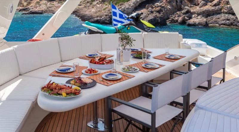 a table with food on it aboard EFMARIA Yacht for Sale