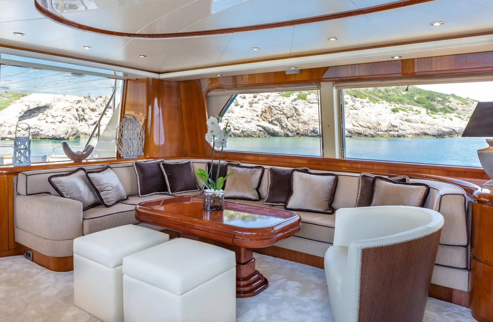 a living room with a couch and a table aboard EFMARIA Yacht for Sale