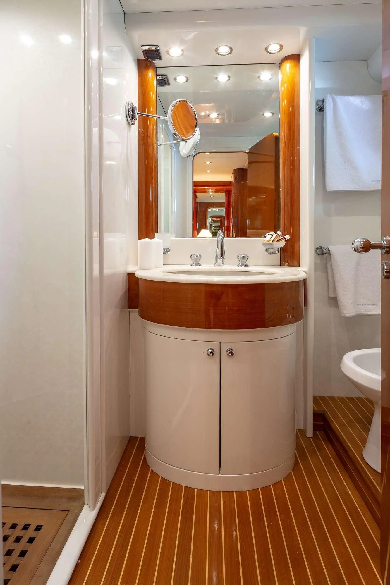 a bathroom with a sink and a mirror aboard EFMARIA Yacht for Sale
