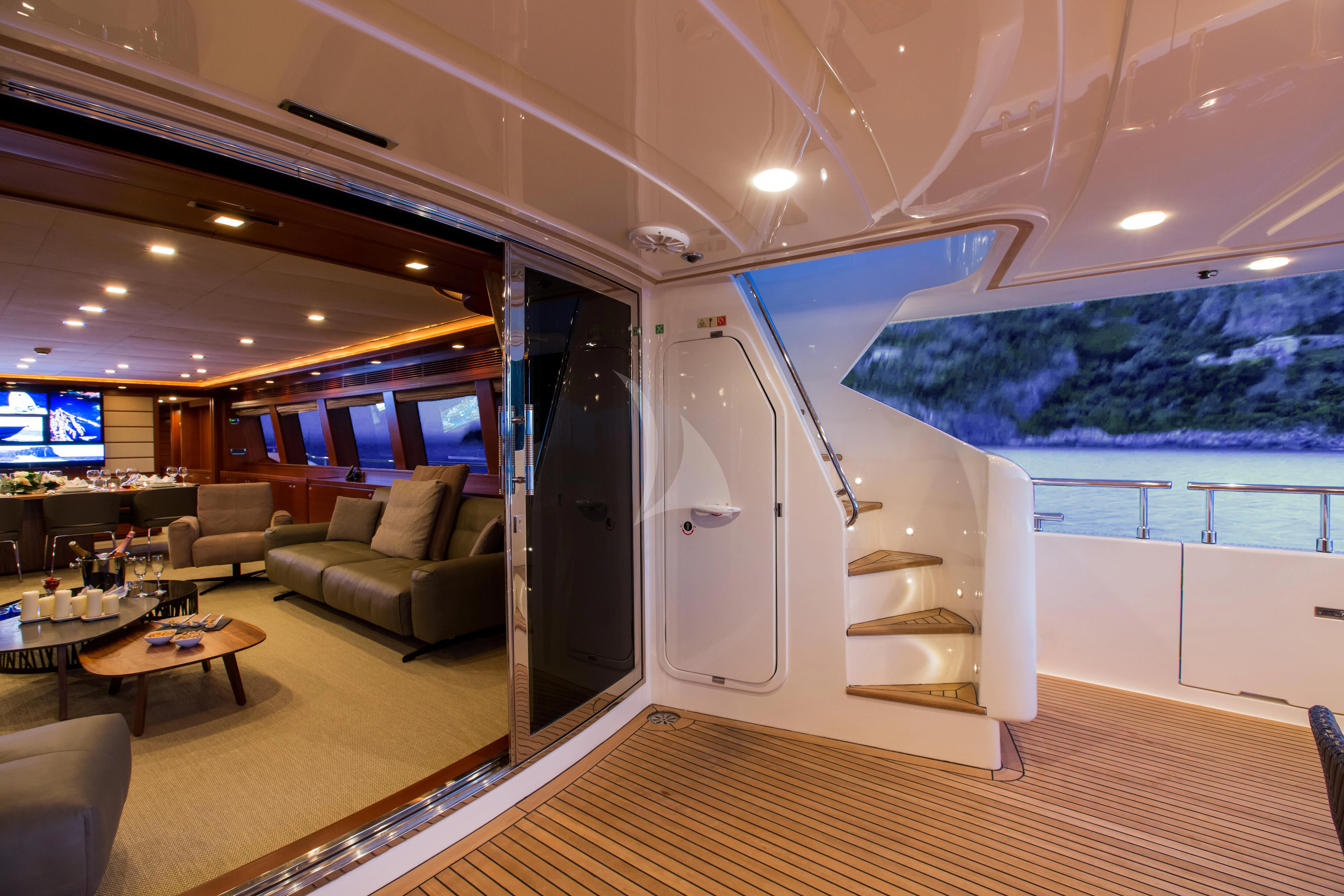 a living room with a large swimming pool aboard ROBUSTO Yacht for Sale