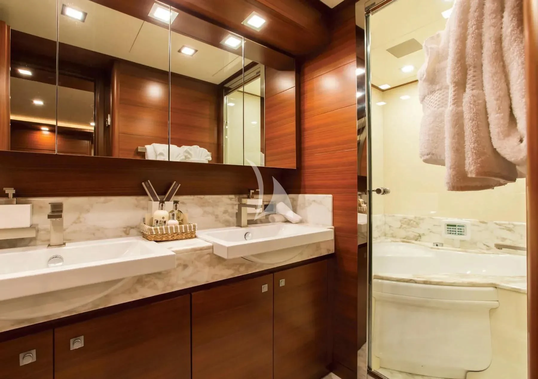 a bathroom with a large mirror aboard ROBUSTO Yacht for Sale