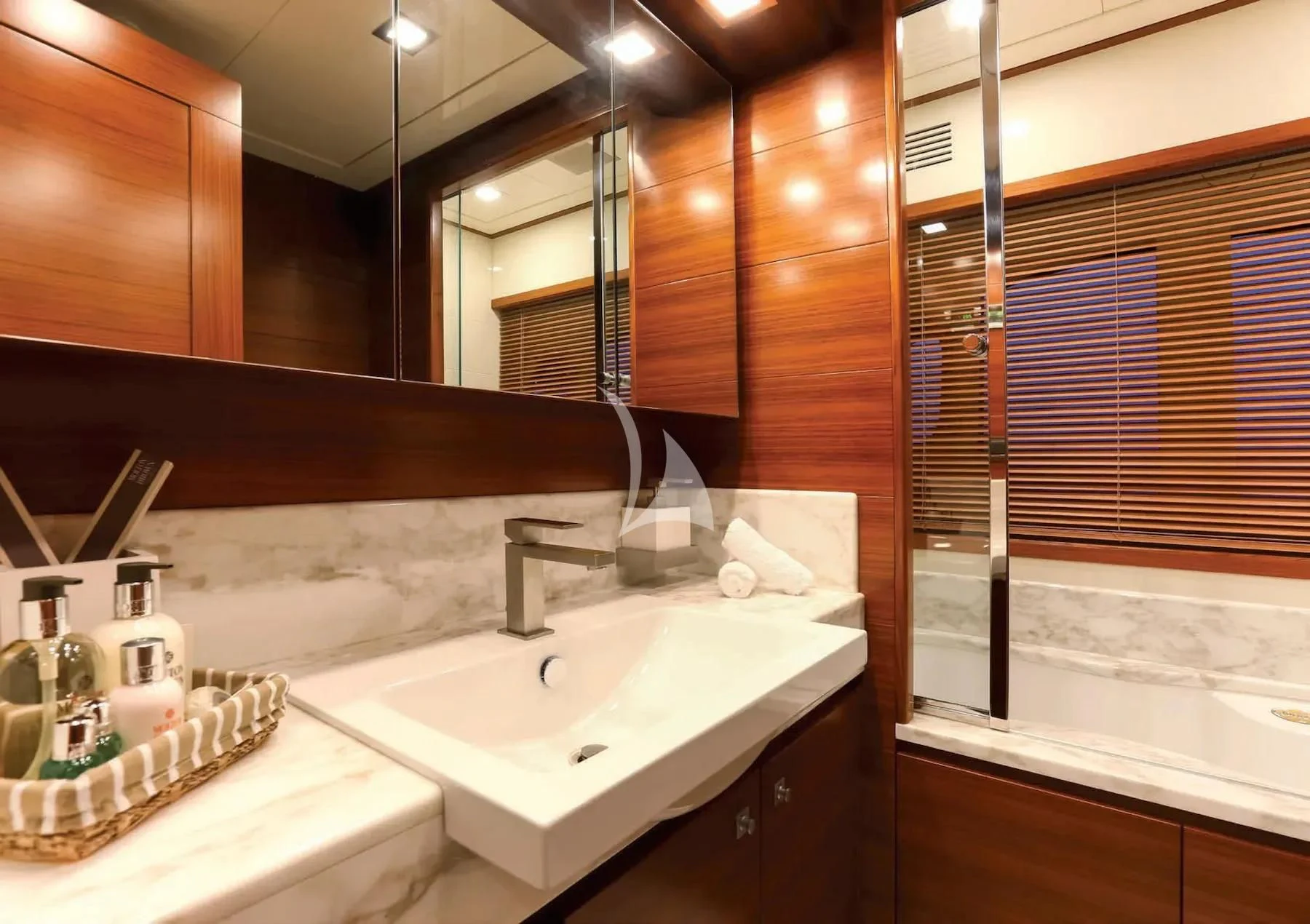 a bathroom with a sink and a mirror aboard ROBUSTO Yacht for Sale