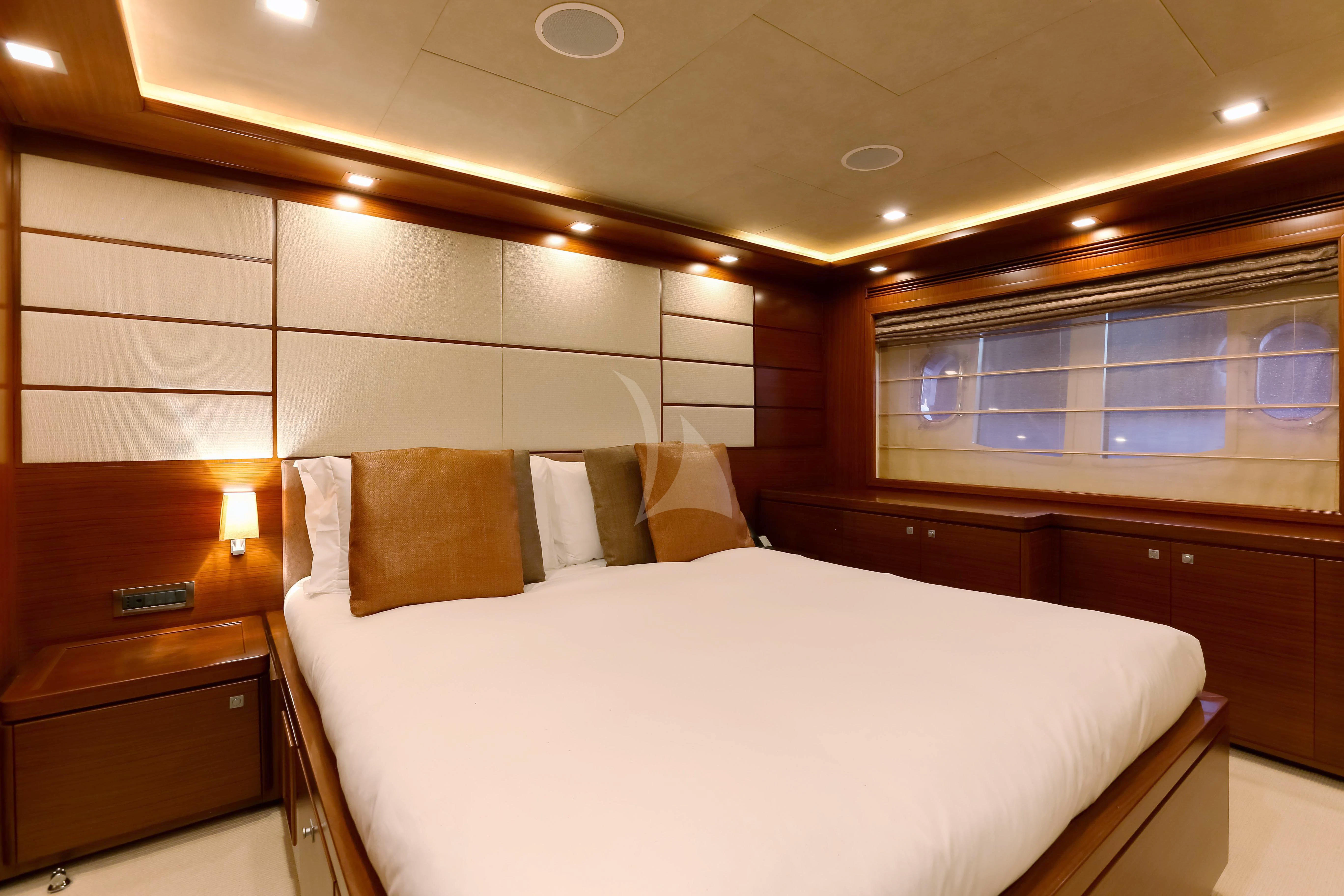 a room with a bed and a window aboard ROBUSTO Yacht for Sale