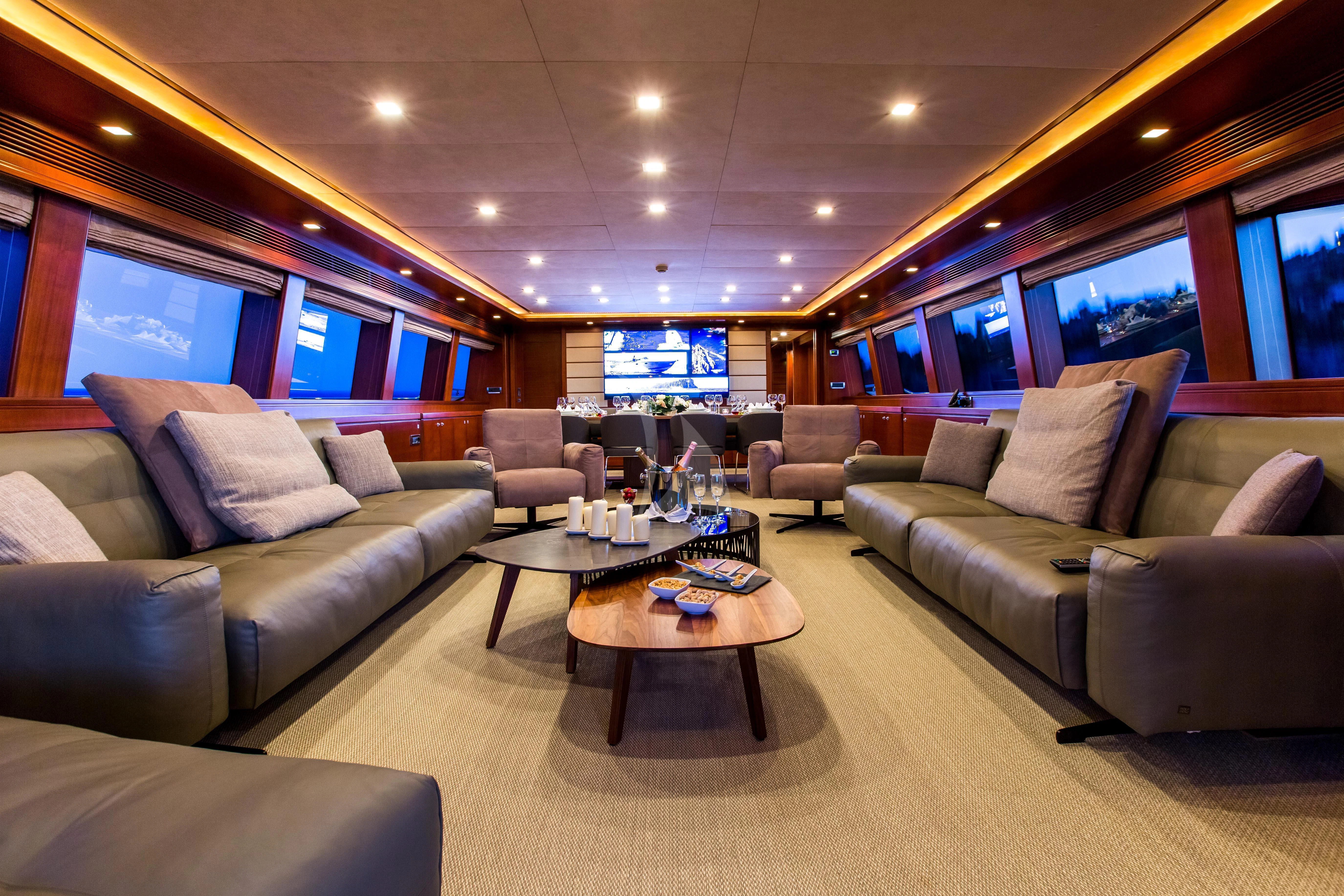 a living room with a couch and a table aboard ROBUSTO Yacht for Sale