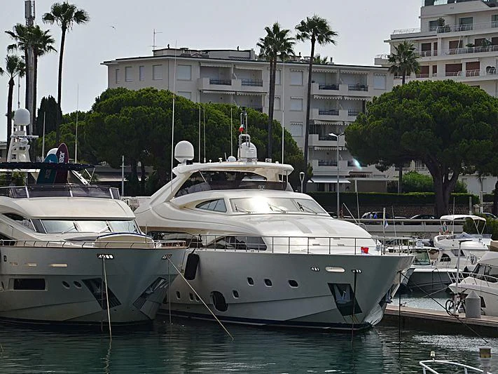a couple of boats sit in a harbor aboard ROBUSTO Yacht for Sale