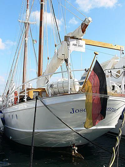 a boat with a flag on it aboard JOSEPH CONRAD Yacht for Sale