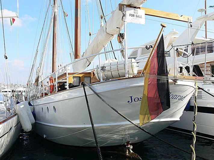 a boat with a flag on the front aboard JOSEPH CONRAD Yacht for Sale