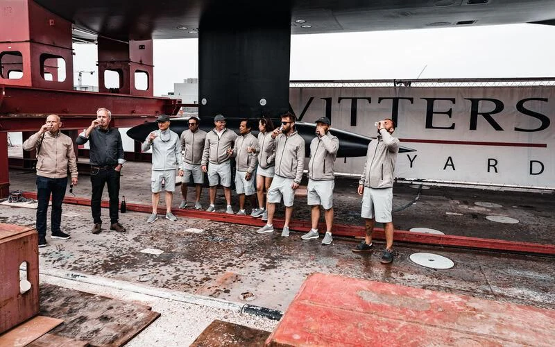 a group of men posing for a photo aboard ALEA Yacht for Sale