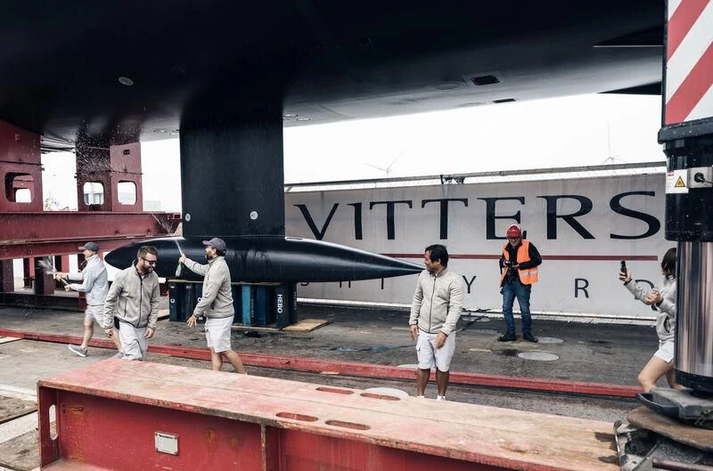 a group of people walking on a platform next to a large airplane aboard ALEA Yacht for Sale