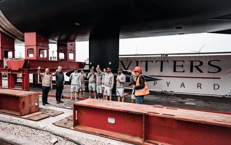 a group of people standing on a platform in front of a train aboard ALEA Yacht for Sale