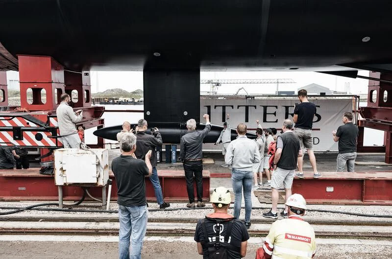 a group of people standing next to a train aboard ALEA Yacht for Sale