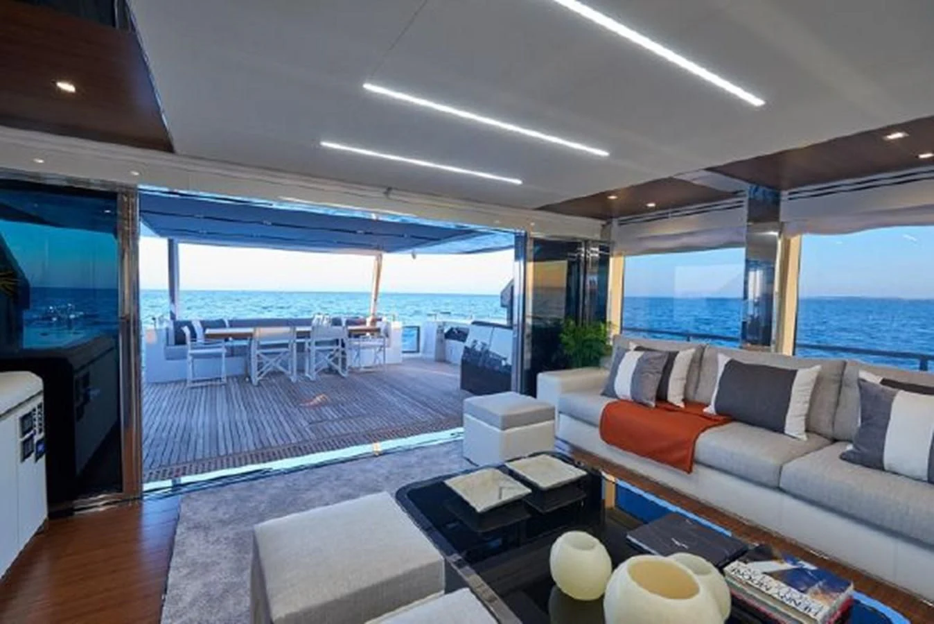 a living room with a large deck aboard 2021 ASTONDOA 100 CENTURY Yacht for Sale