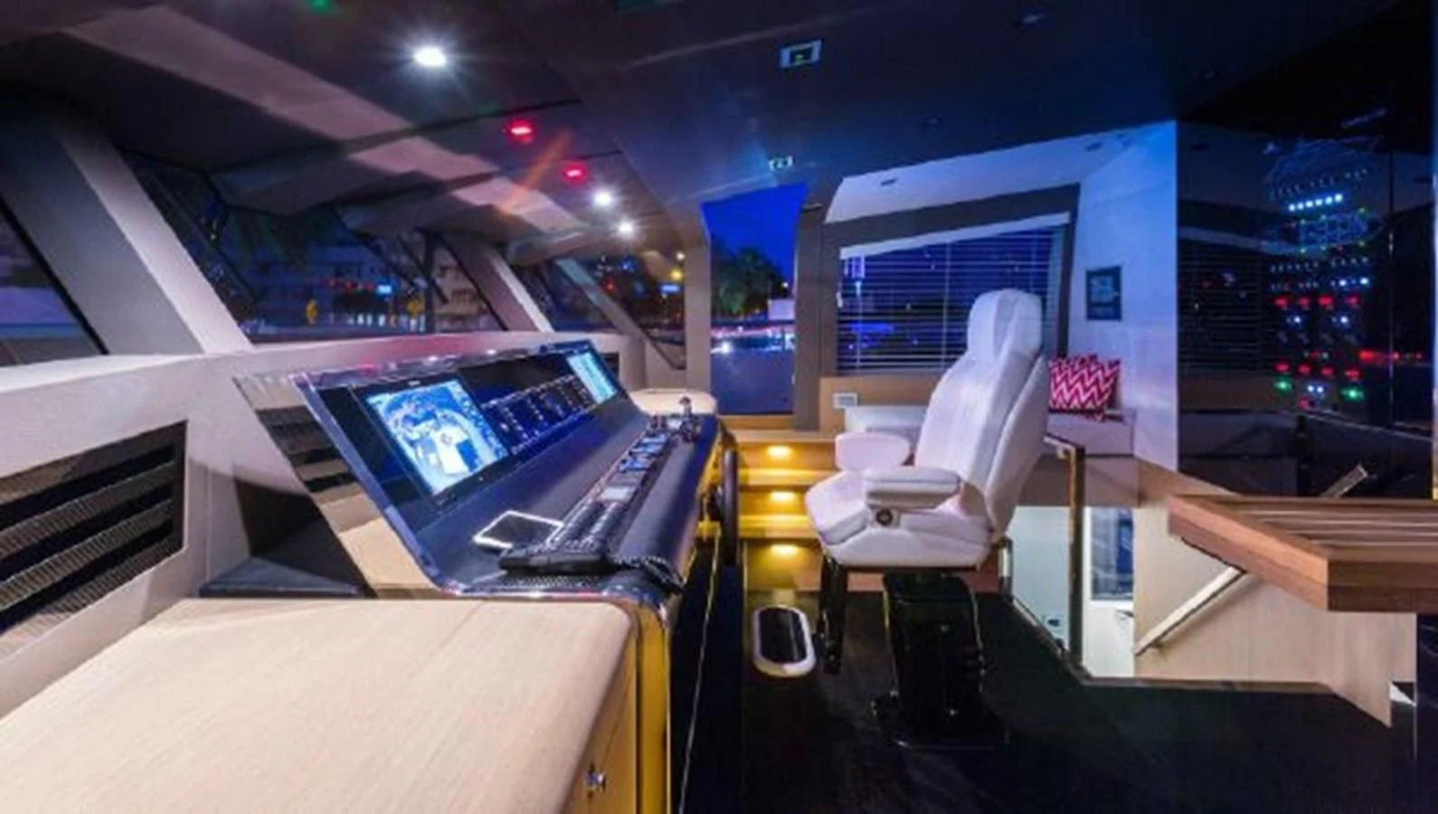 a room with a large television and a table with chairs aboard 2021 ASTONDOA 100 CENTURY Yacht for Sale