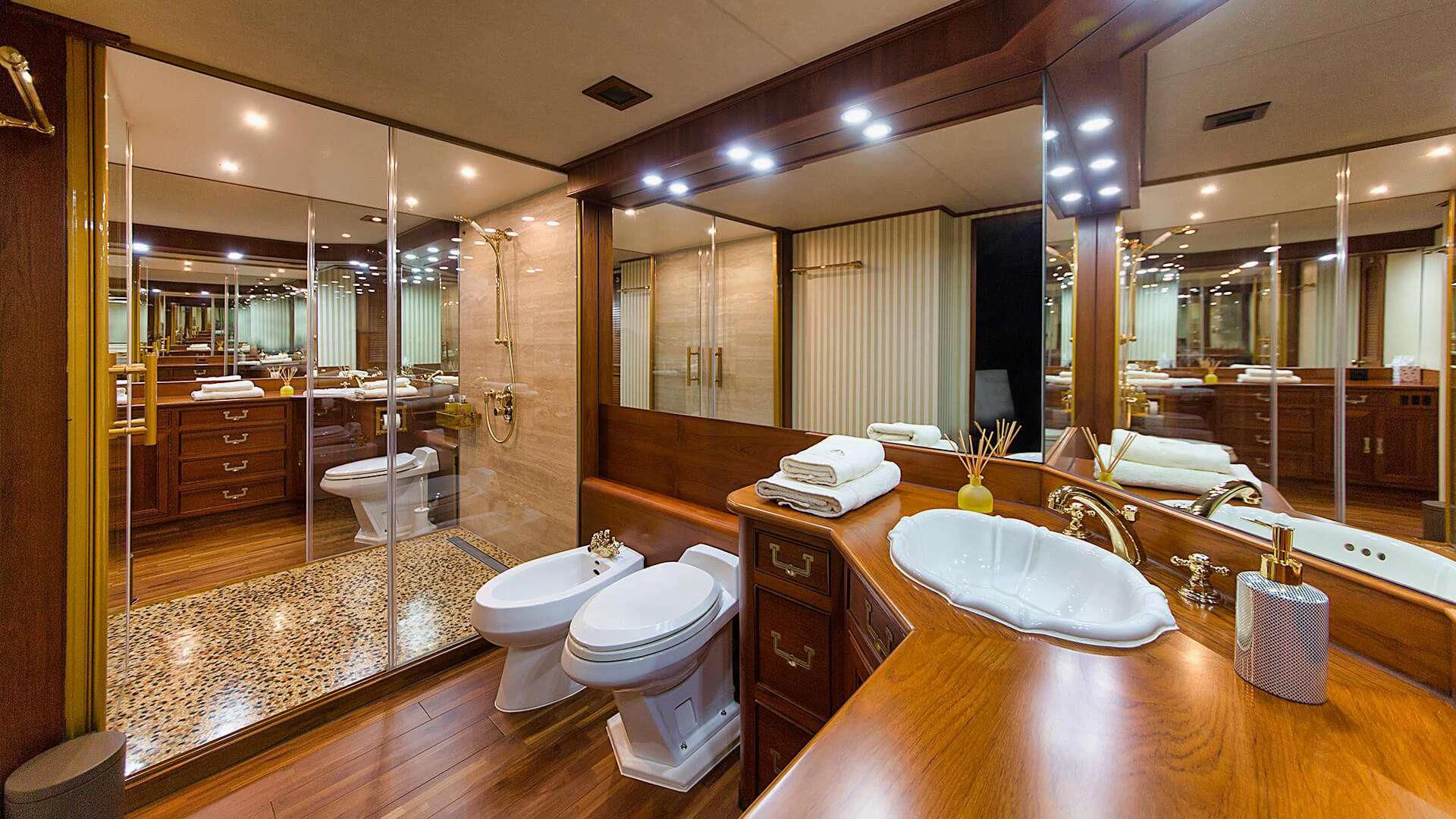 a bathroom with a large mirror aboard AURIANE Yacht for Sale