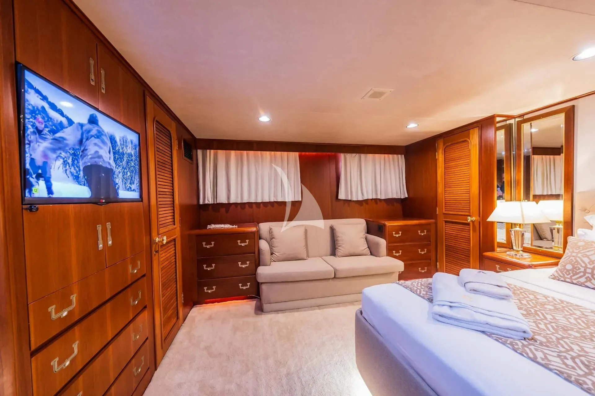 a bedroom with a bed and a television aboard AURIANE Yacht for Sale