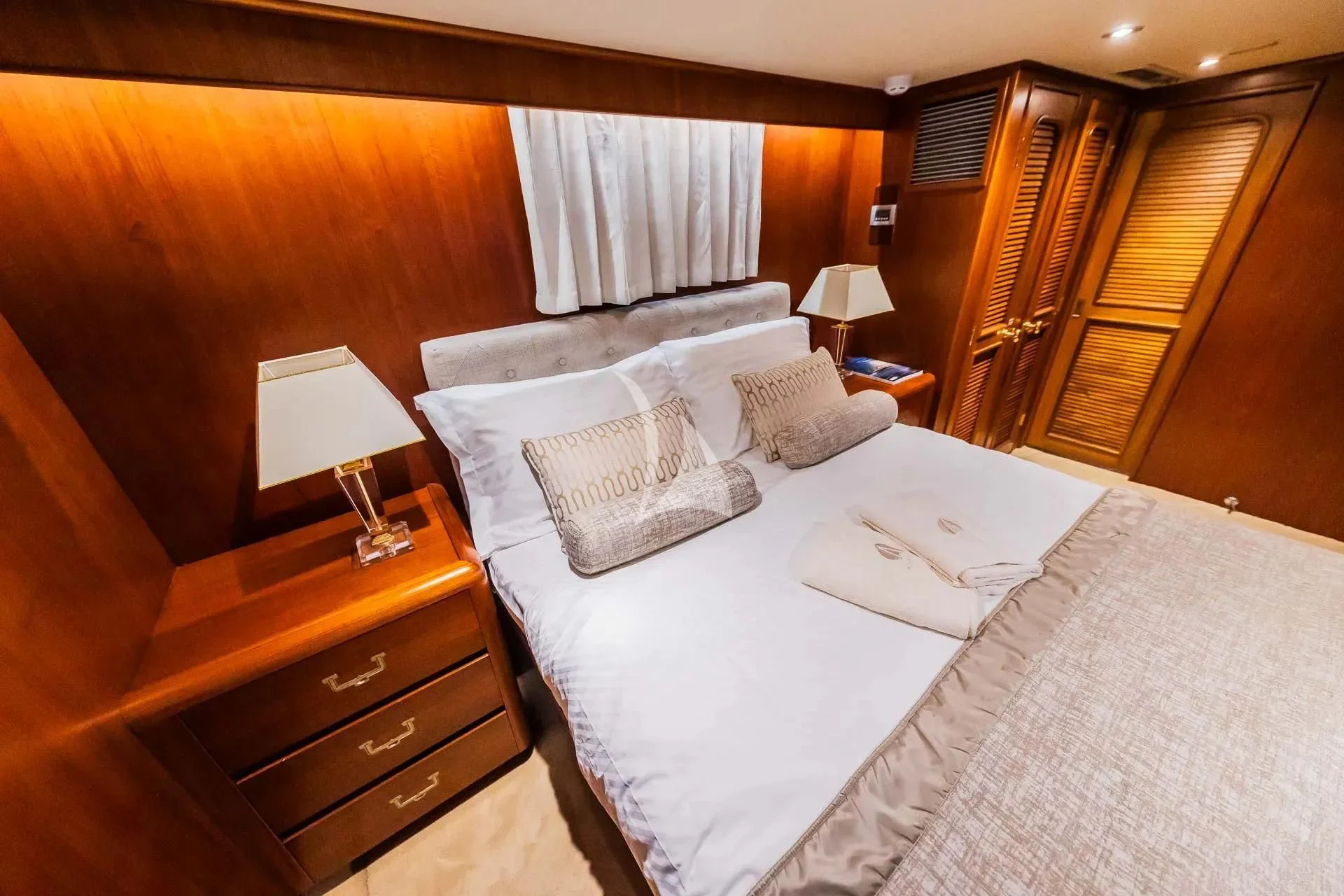 a hotel room with a bed and a desk aboard AURIANE Yacht for Sale