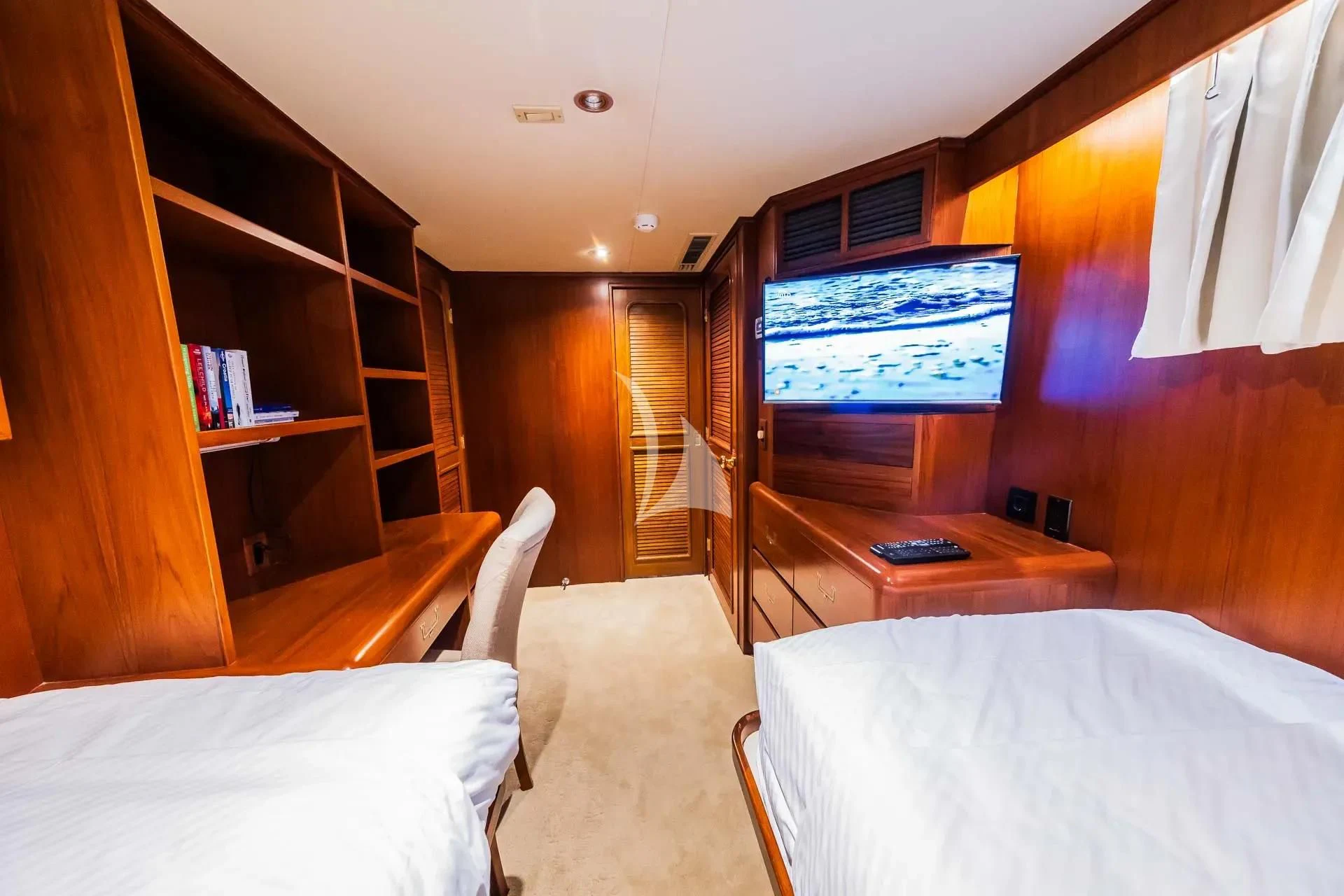 a room with a tv and a bed aboard AURIANE Yacht for Sale