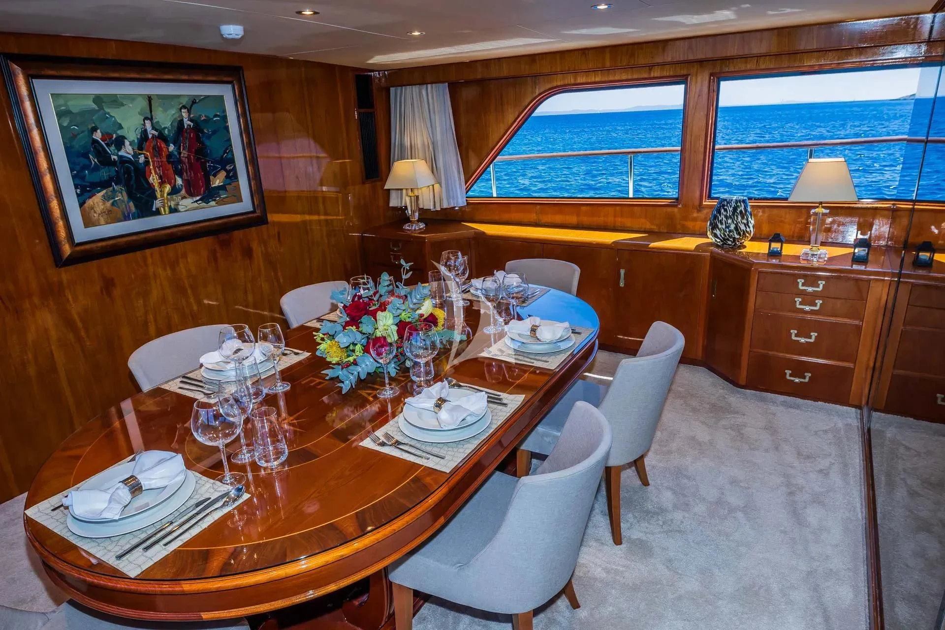 a dining table in a room aboard AURIANE Yacht for Sale