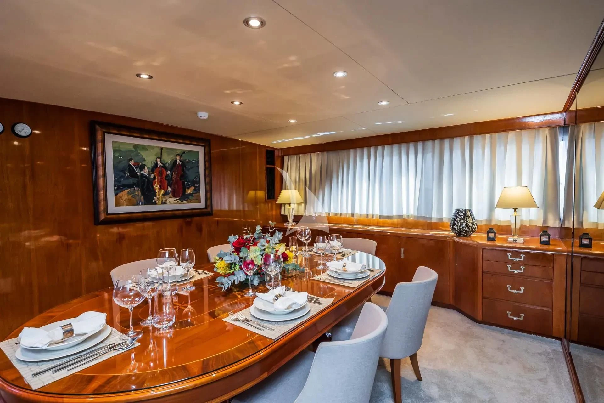 a dining table in a room aboard AURIANE Yacht for Sale
