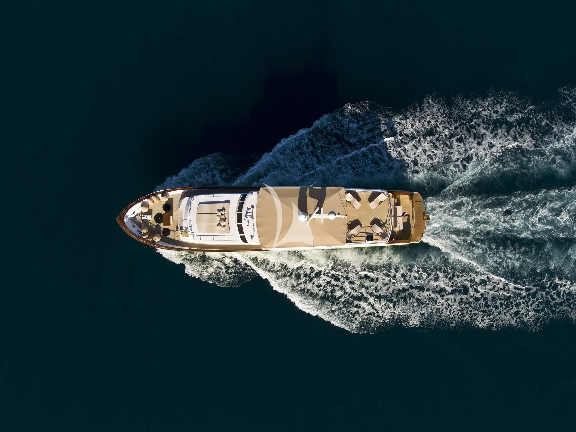 a bottle of beer on a blue surface aboard AURIANE Yacht for Sale