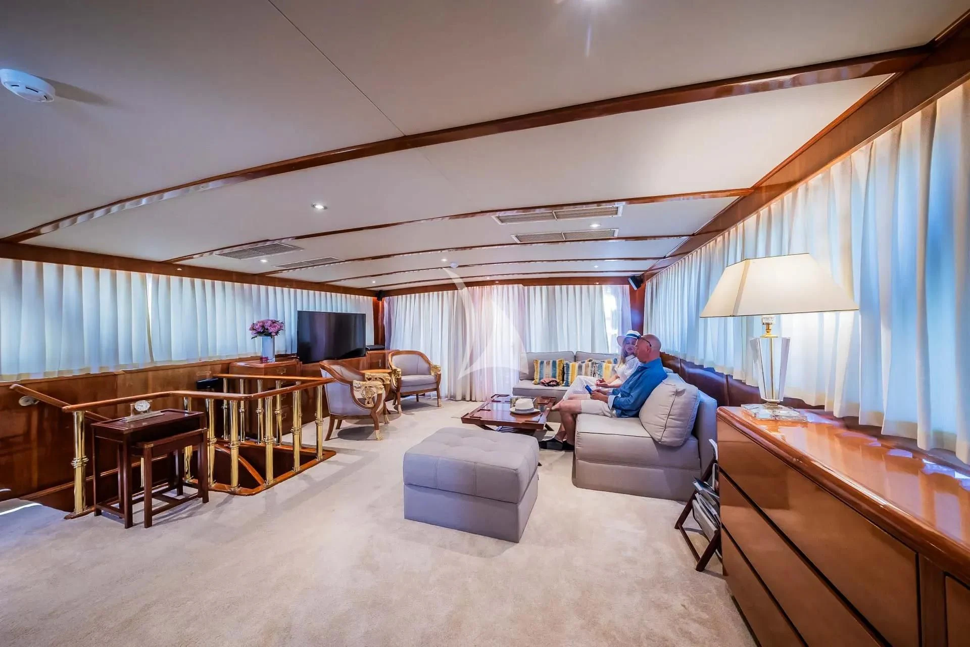 a living room with a large window aboard AURIANE Yacht for Sale