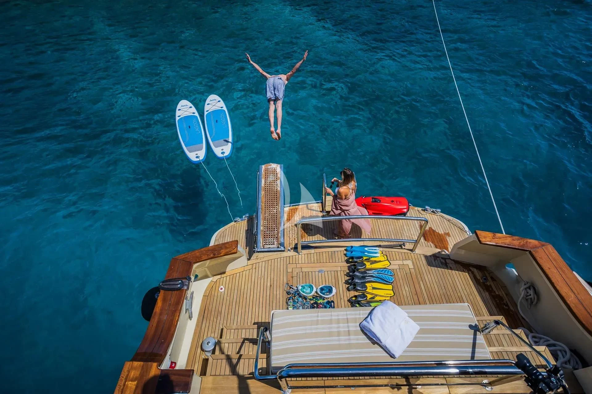 a man and woman on a boat aboard AURIANE Yacht for Sale