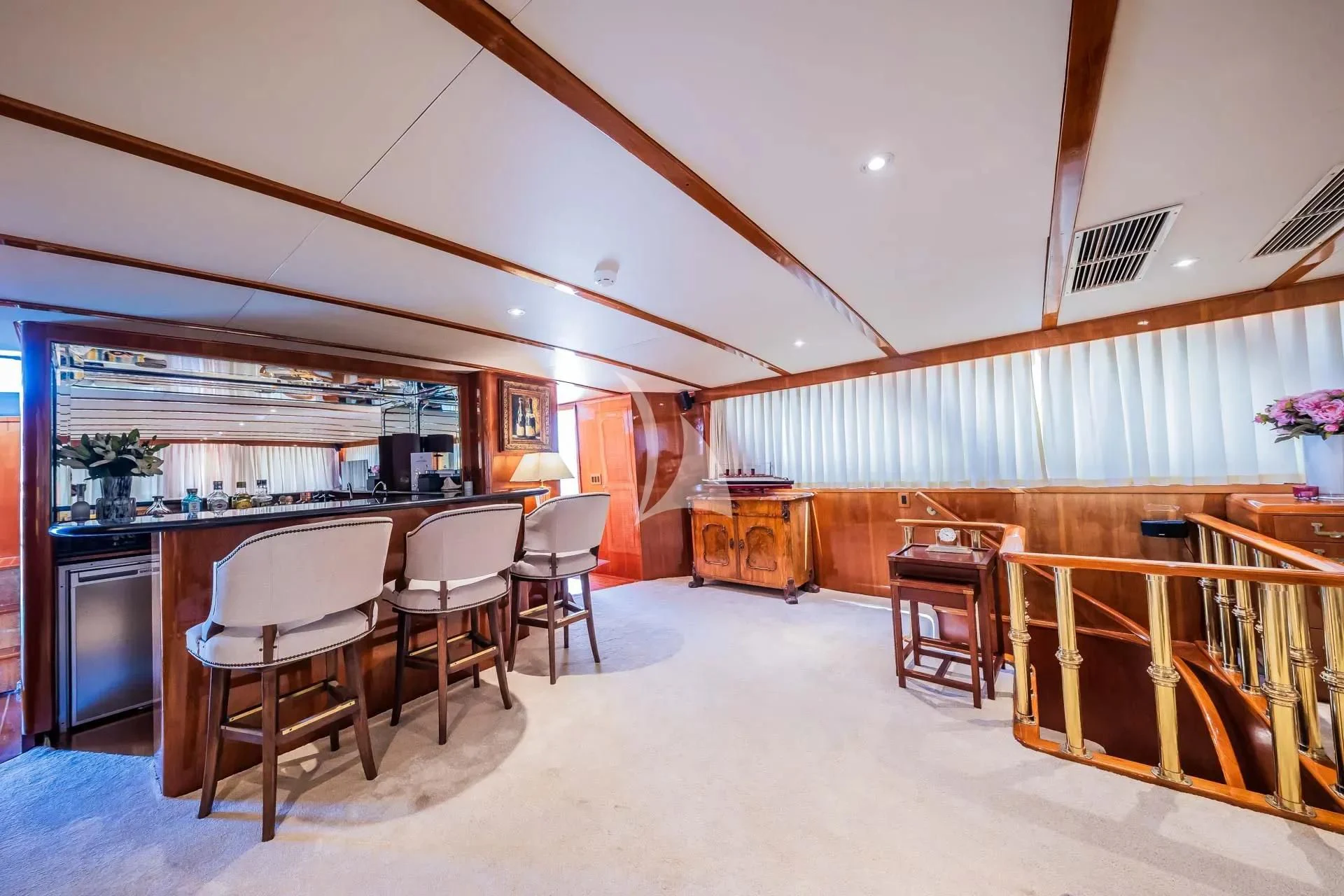 a large room with a table and chairs aboard AURIANE Yacht for Sale