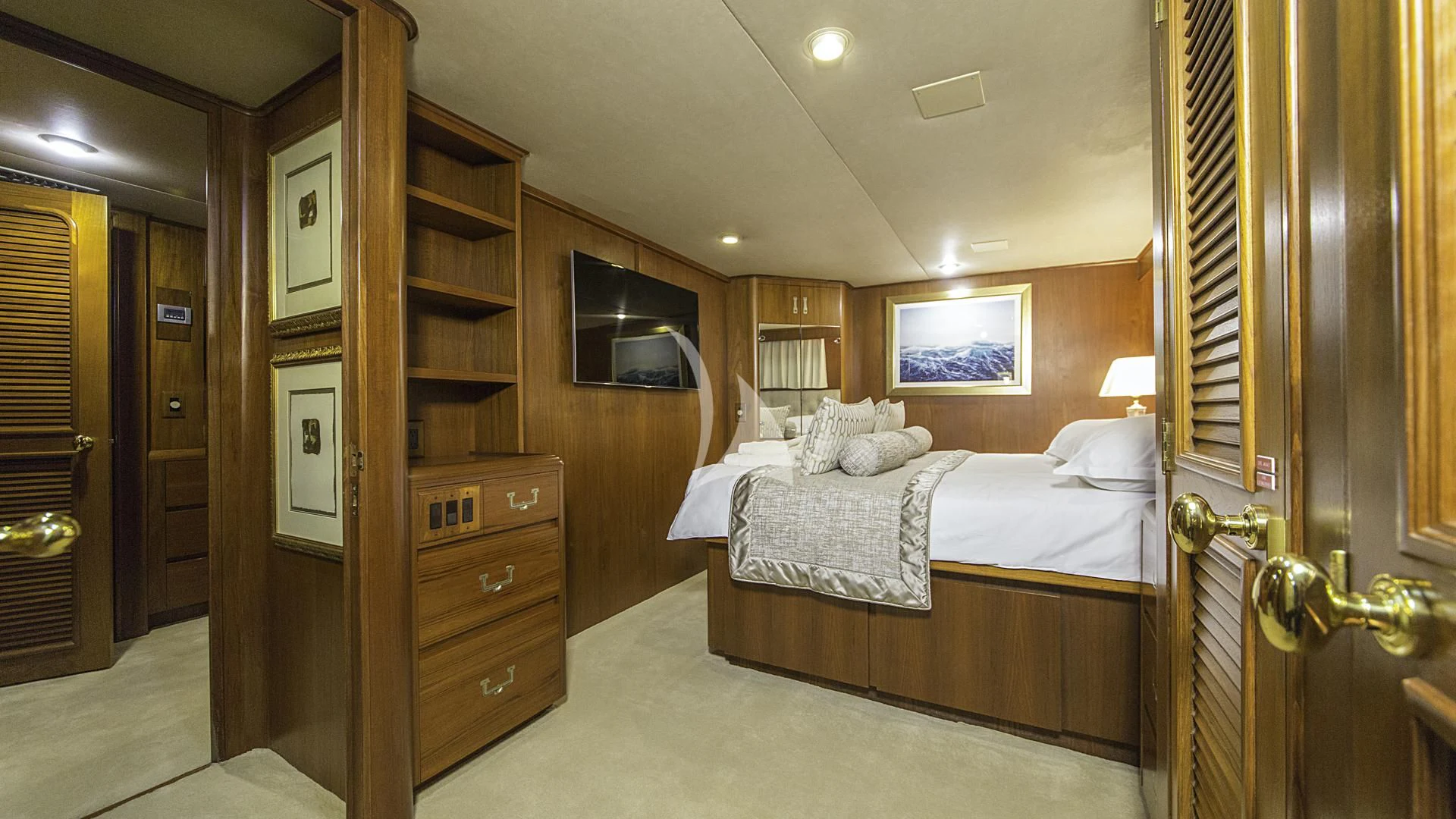 a room with a bed and a television aboard AURIANE Yacht for Sale
