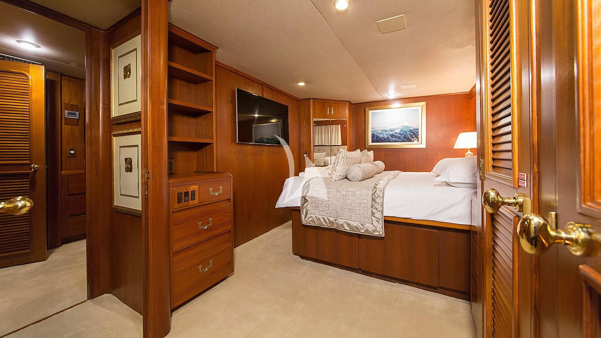 a bedroom with a bed and a closet aboard AURIANE Yacht for Sale