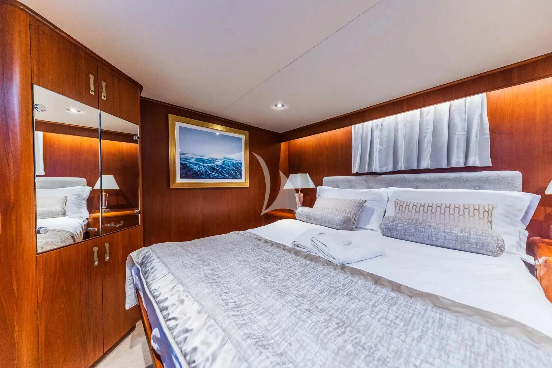 a bed with white sheets aboard AURIANE Yacht for Sale