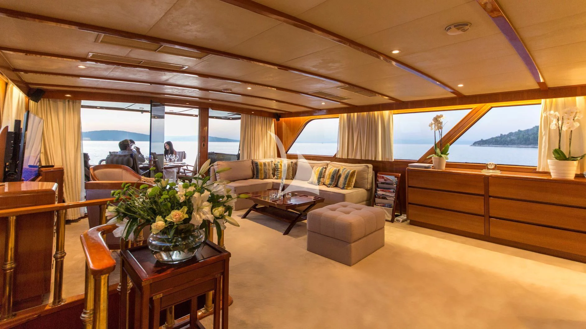 a living room with a large window aboard AURIANE Yacht for Sale