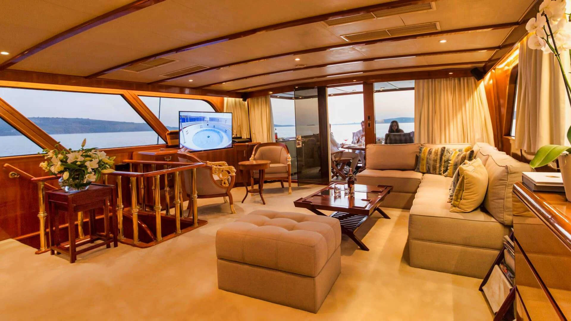 a living room with a large window aboard AURIANE Yacht for Sale