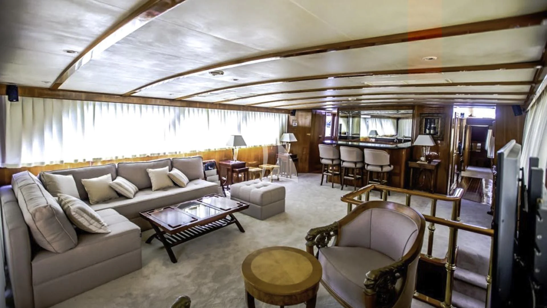a living room with a large window aboard AURIANE Yacht for Sale