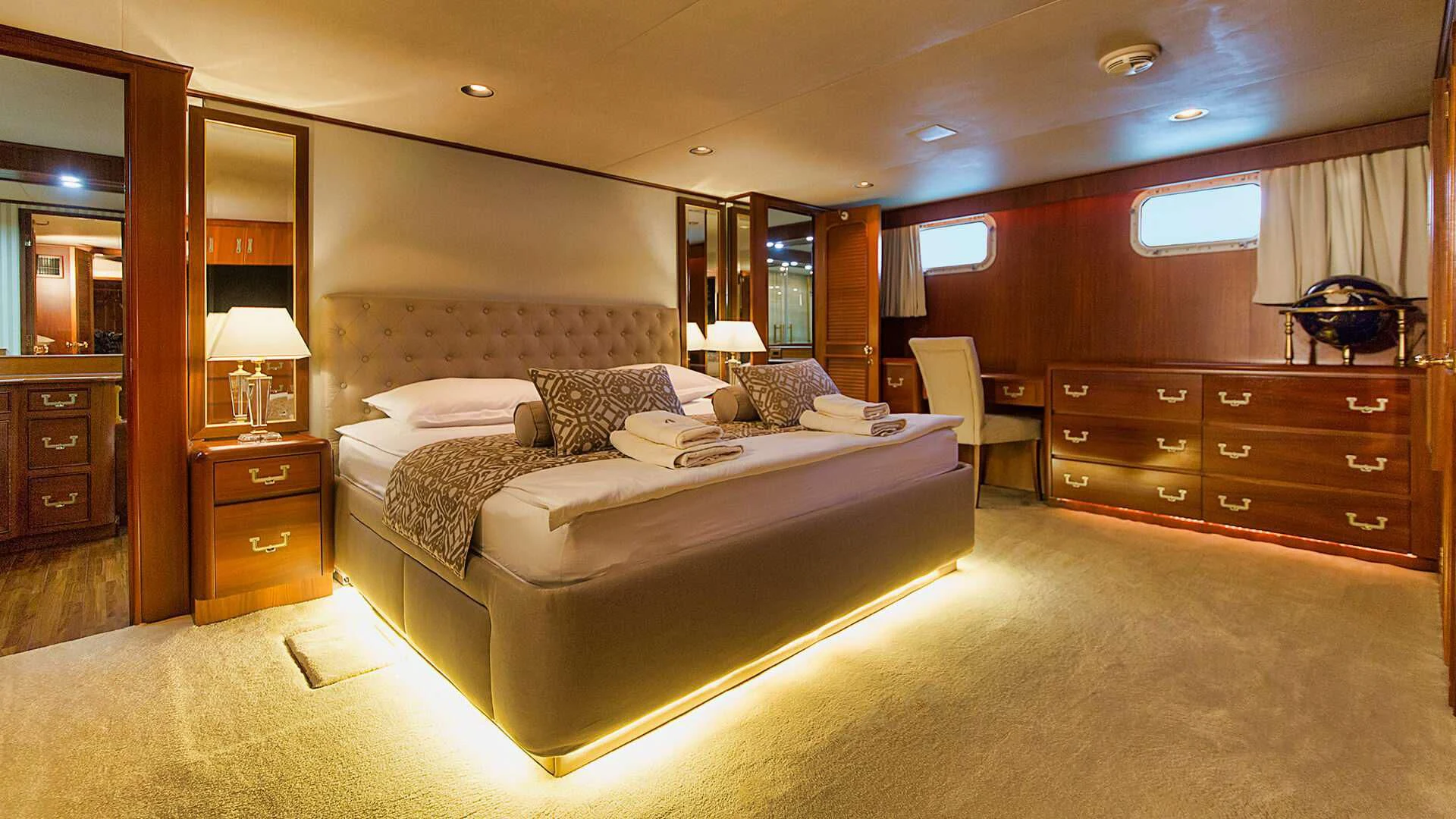 a large bedroom with a large bed aboard AURIANE Yacht for Sale
