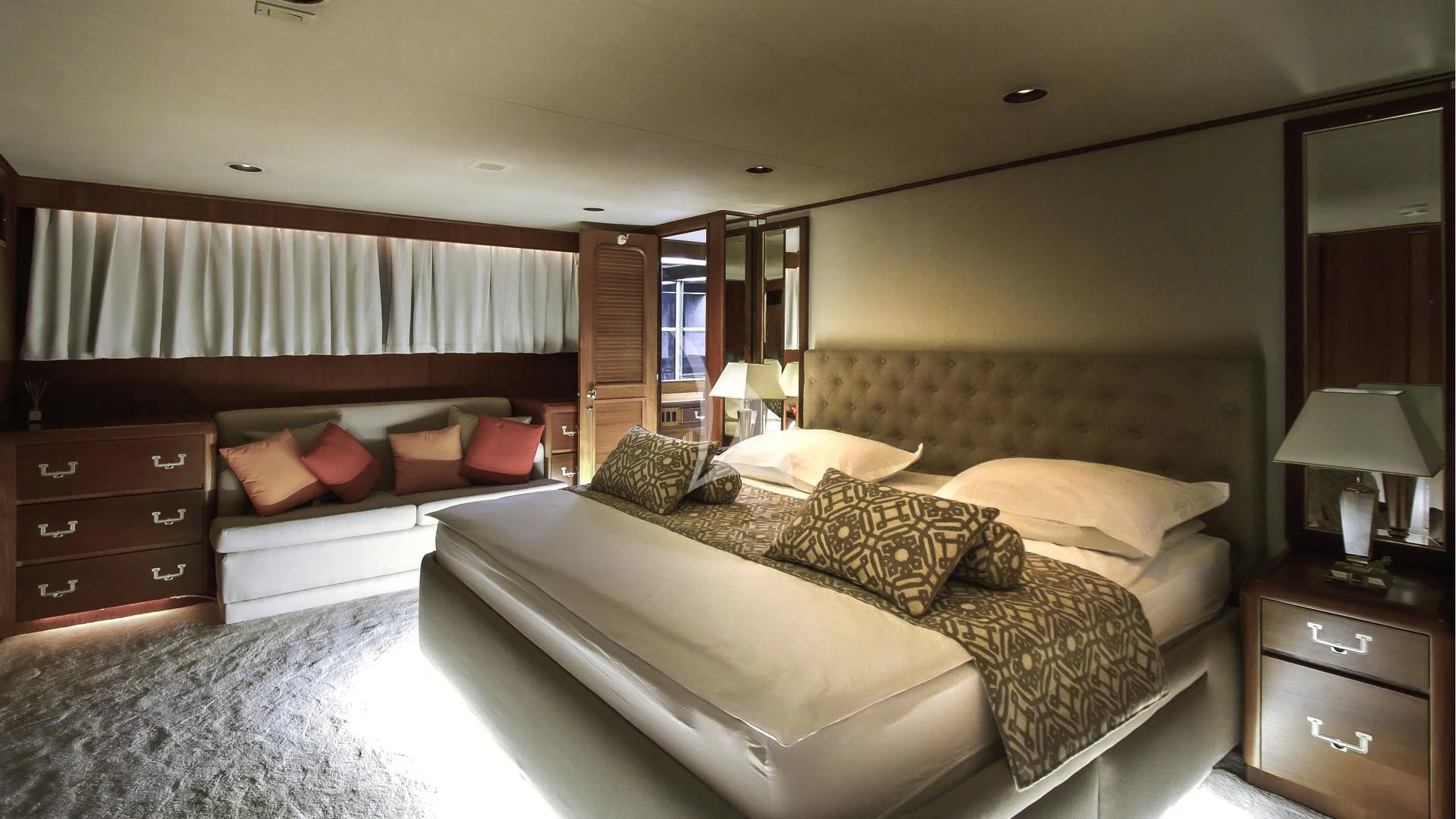a hotel room with a bed and a mirror aboard AURIANE Yacht for Sale