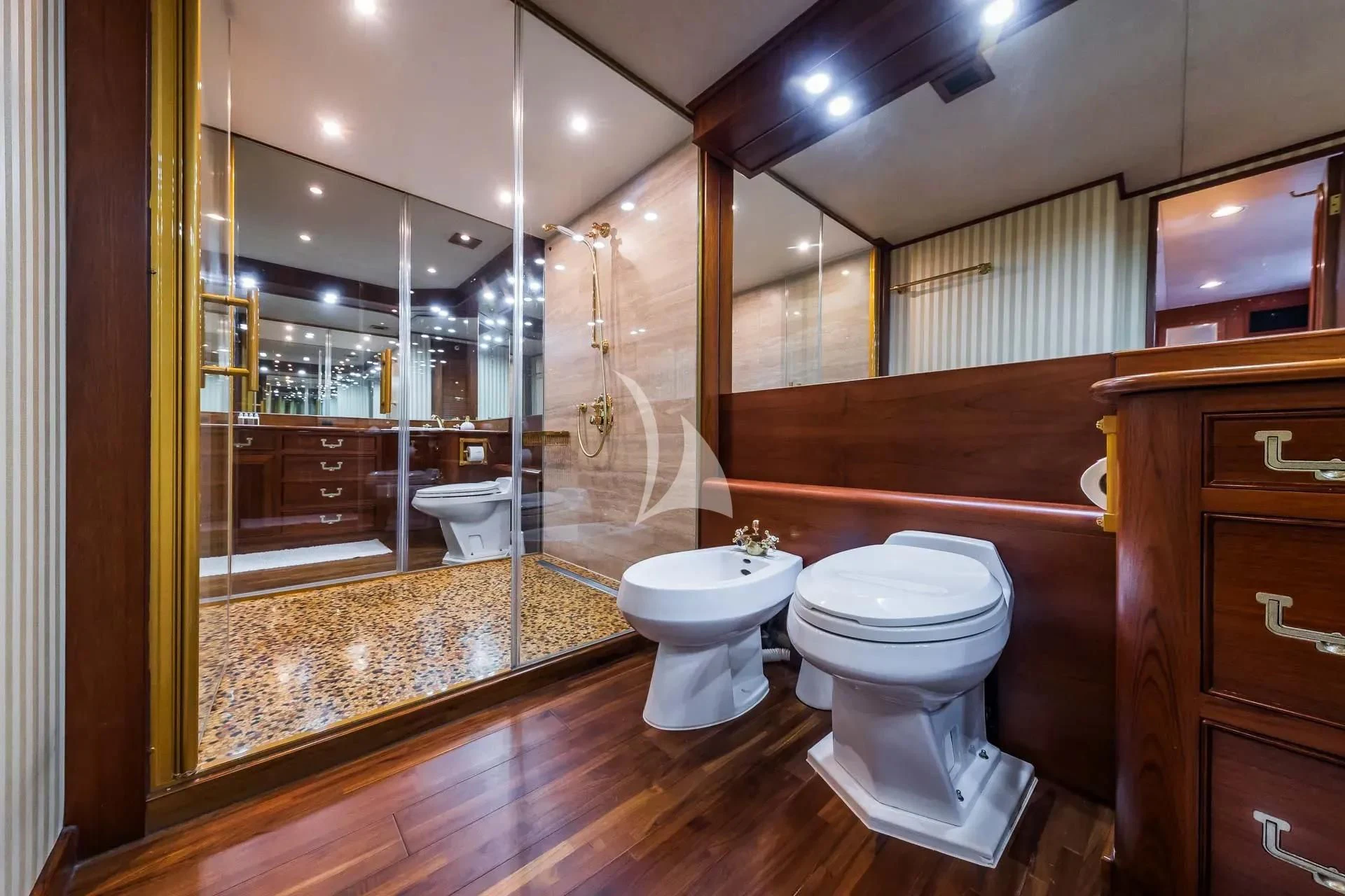 a bathroom with a glass shower aboard AURIANE Yacht for Sale