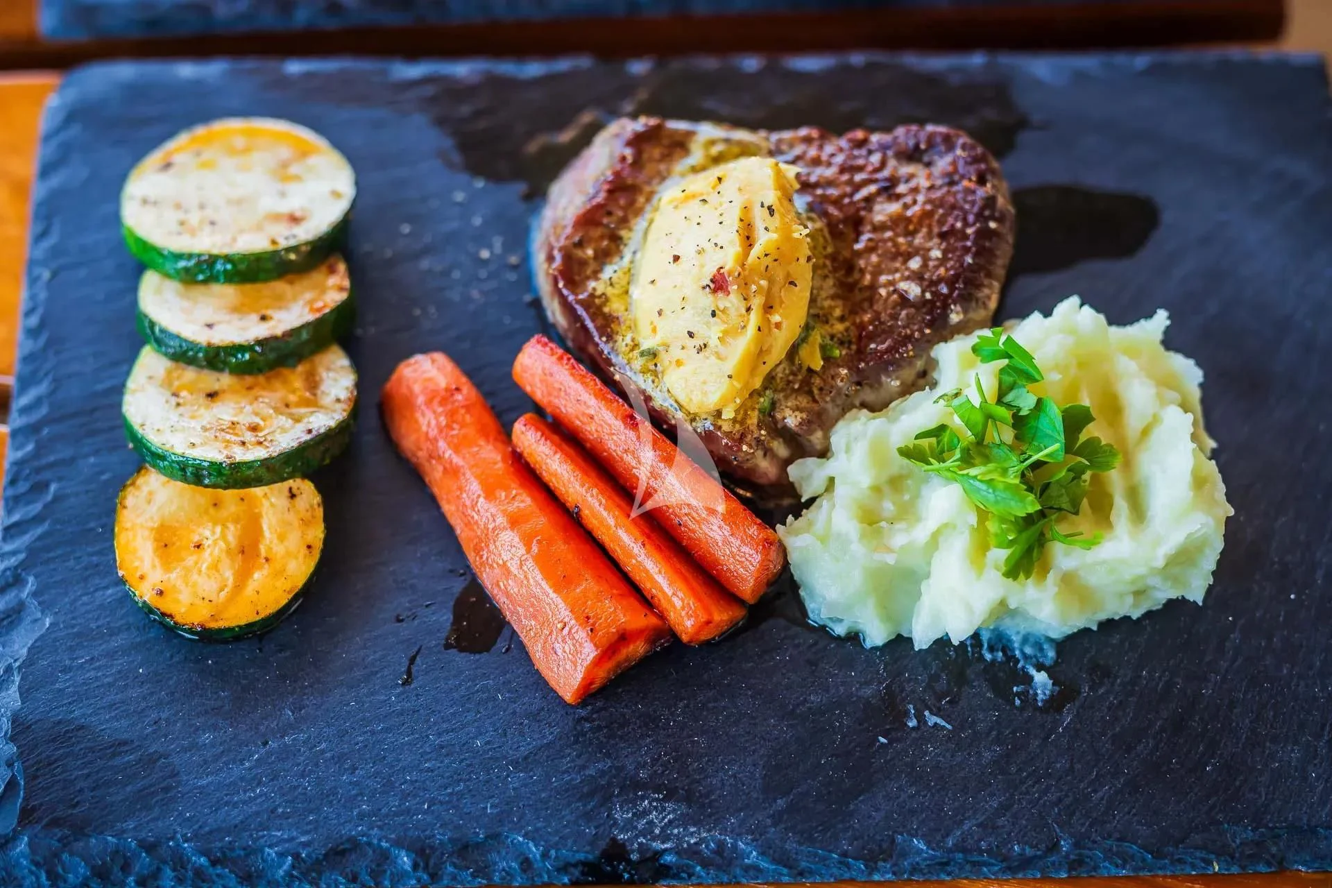 a plate of food aboard AURIANE Yacht for Sale