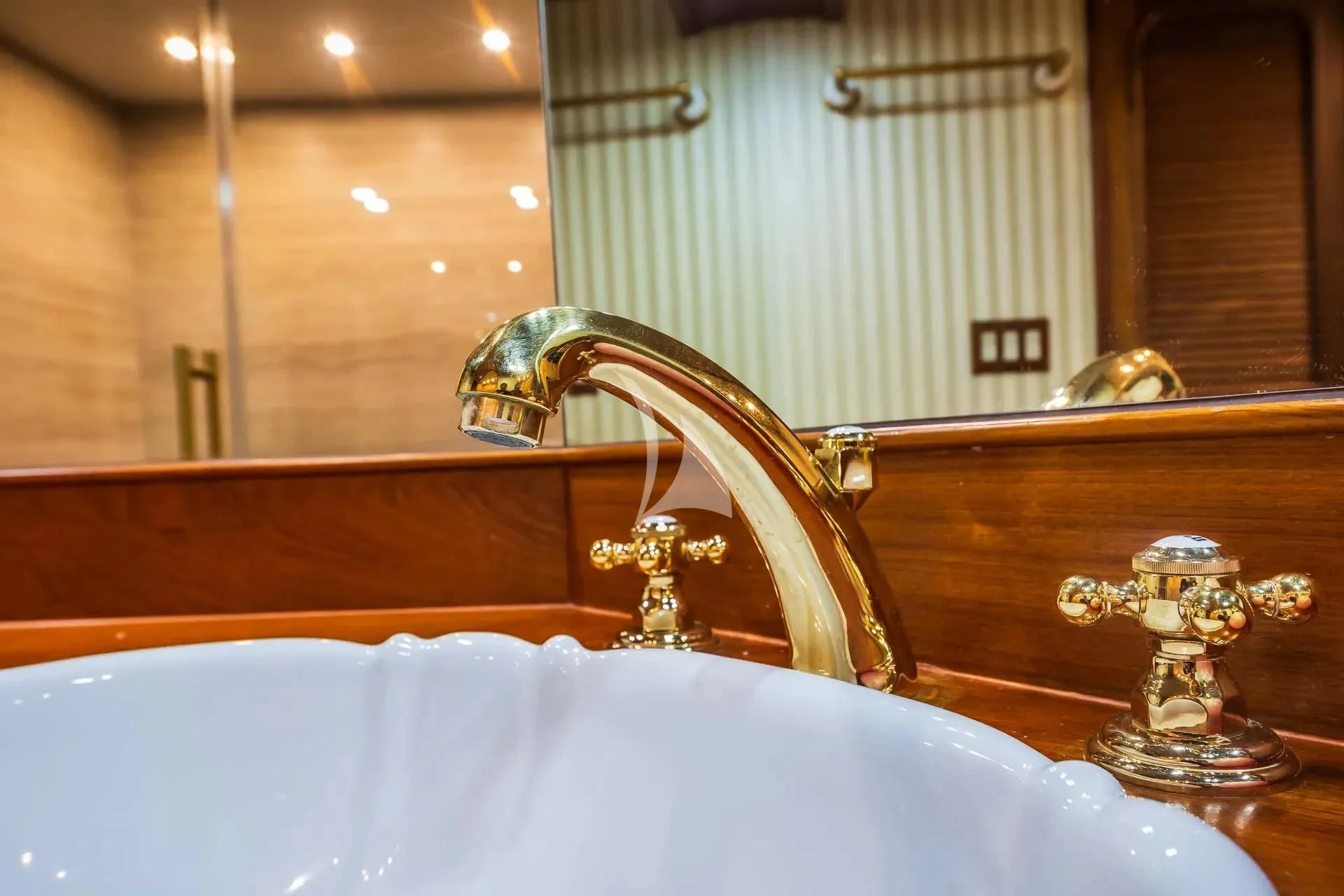 a bathroom sink with a large mirror aboard AURIANE Yacht for Sale