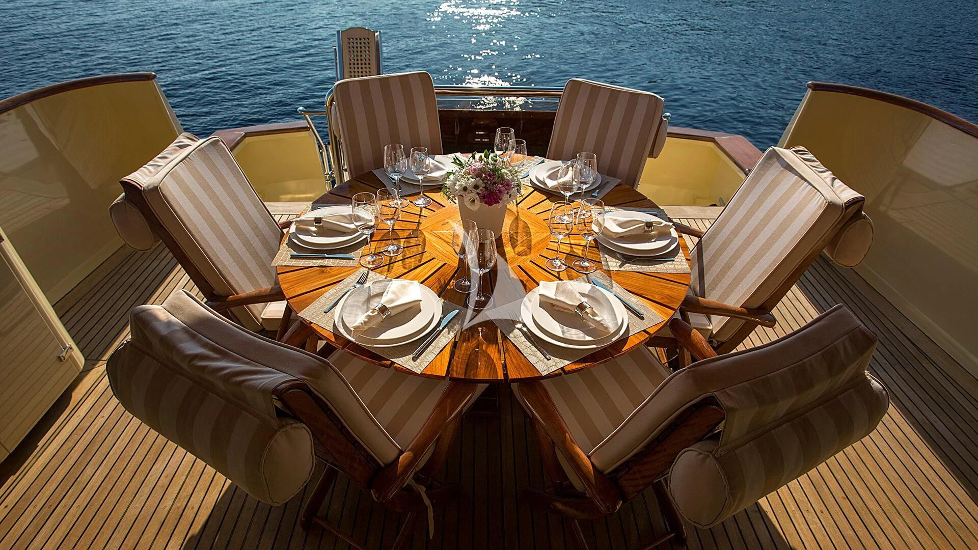 a table set for a dinner aboard AURIANE Yacht for Sale