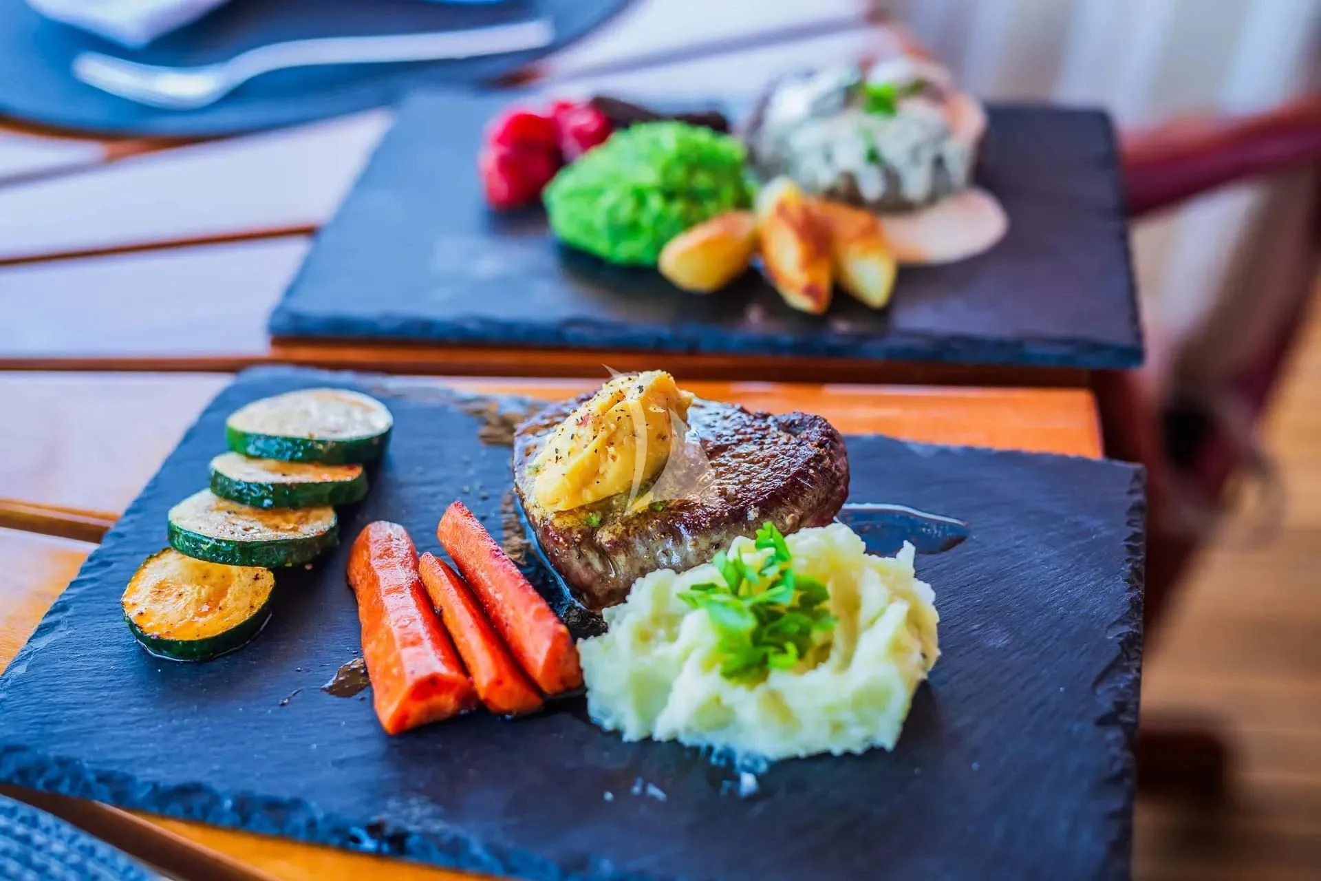 a plate of food aboard AURIANE Yacht for Sale